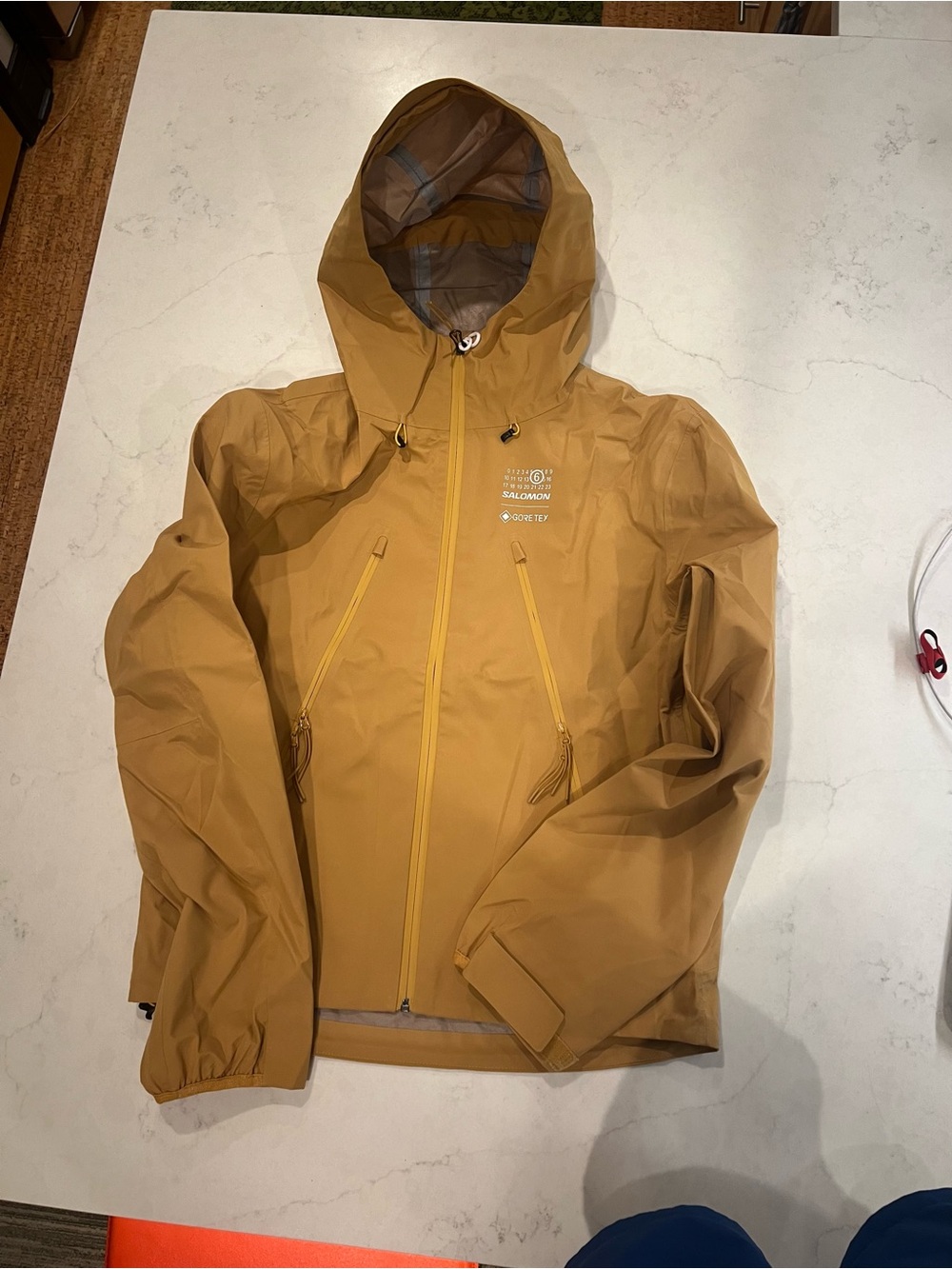 MM6 x Salomon GORE-TEX Hooded Windbreaker
Color: Iced Coffee